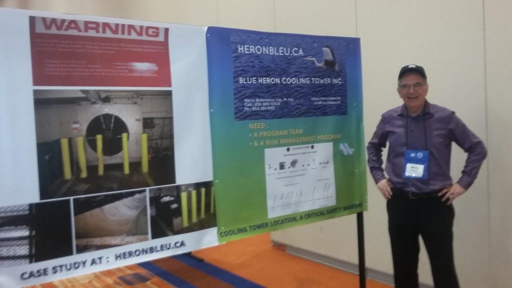 Mario Bellavance beside a poster at a NSF Conference